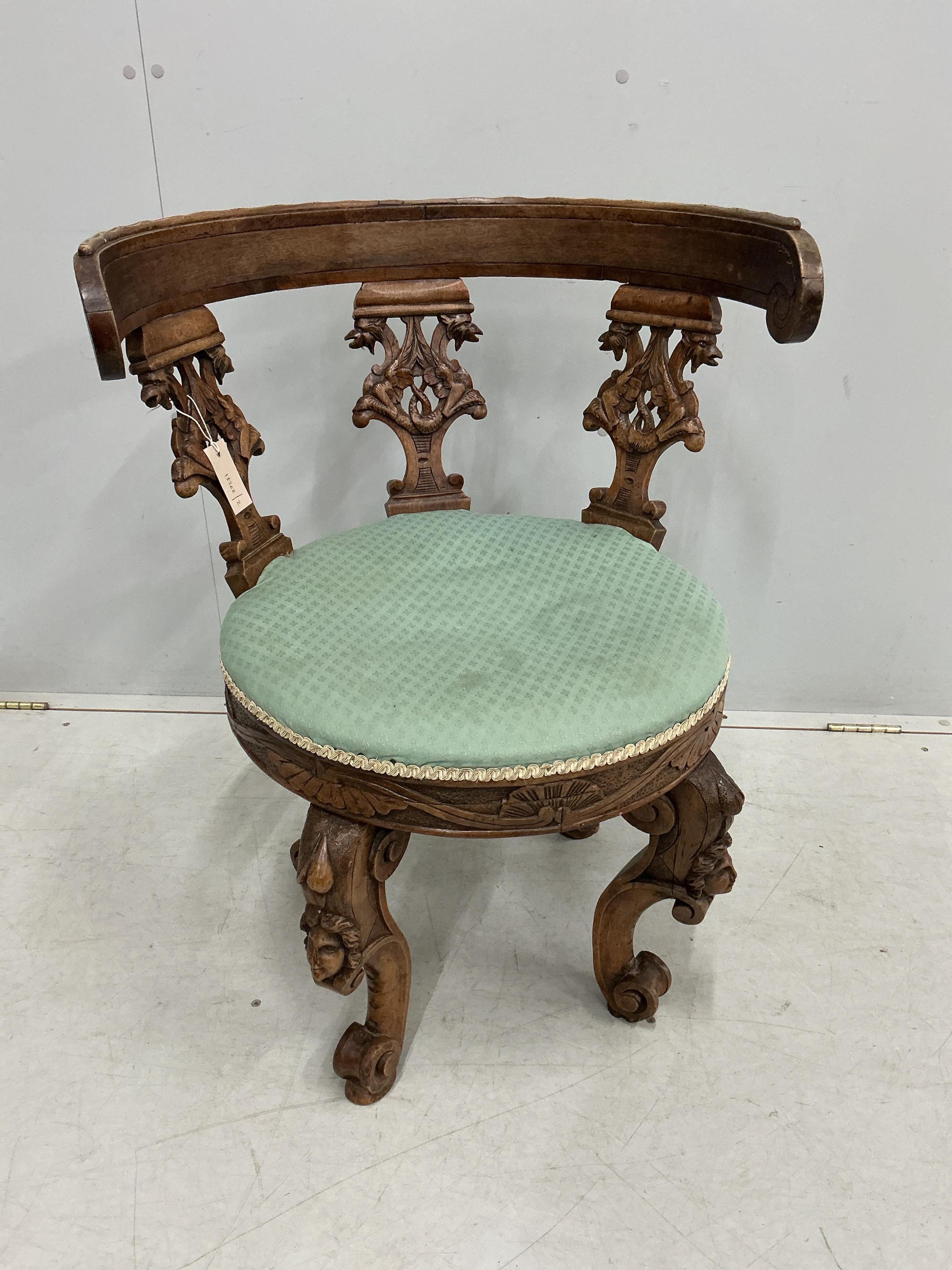 A late 19th century Italian carved walnut tub framed chair, width 61cm, depth 51cm, height 79cm
